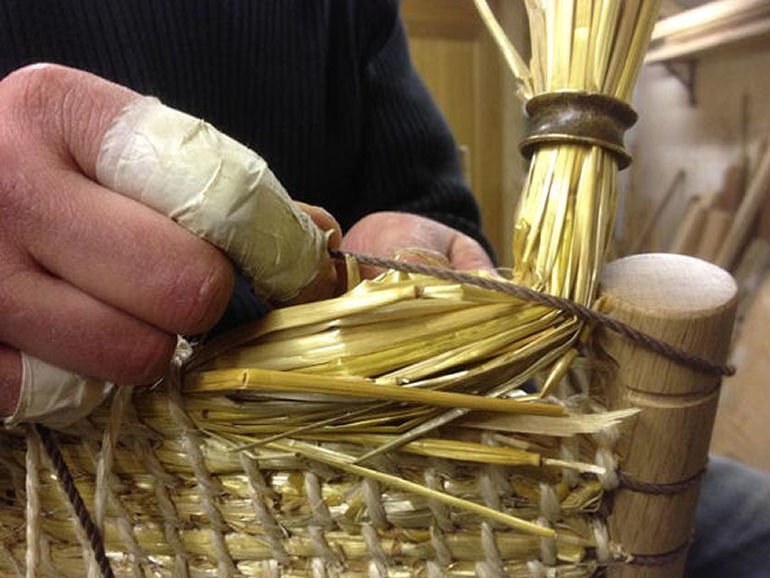 Sewing the straw back of the Brodgar chair for The New Craftsmen collaboration