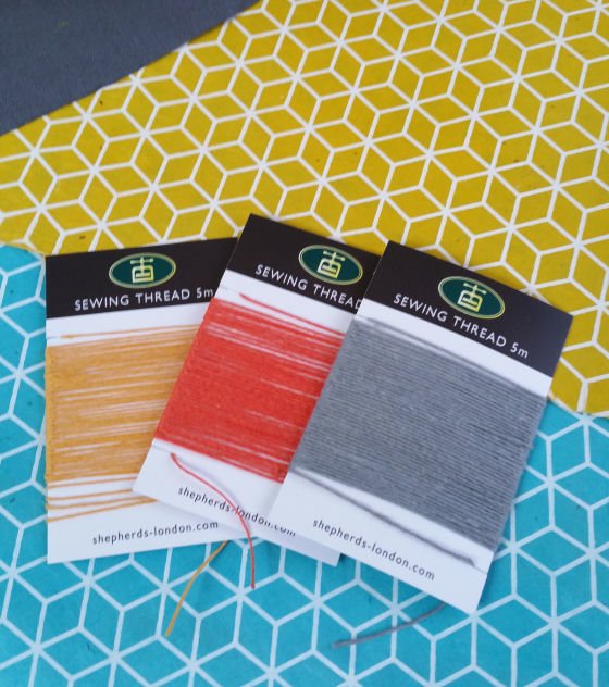 Bookbinding supplies: colourful lokta papers and linen threads