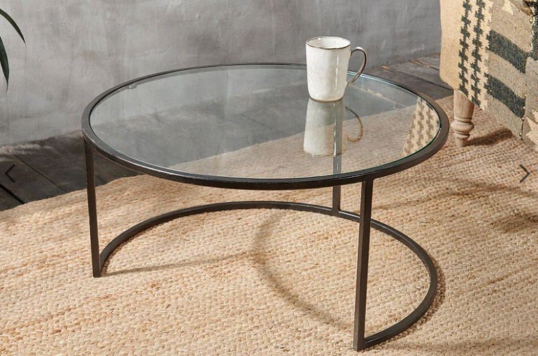 Nakuru Iron and Glass Coffee Table, round glass coffee table for small spaces by Nkuku on seagrass rug