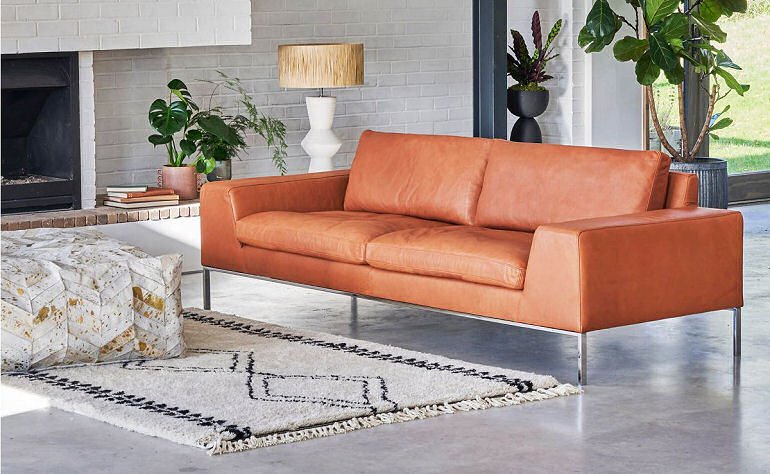 Graham Green Luke leather sofa with mid century syle in cognac leather