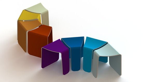 Multicoloured tessellated stools arranged in curve