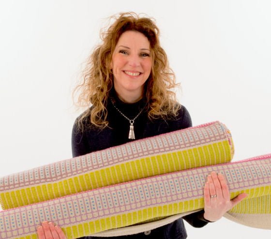 Angie Parker with her colourful Bodacious Handwoven Eco Rugs