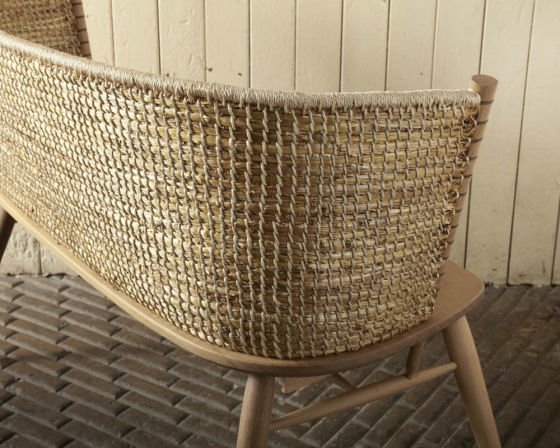 Back view of the straw back of the Brodgar Bench in The New Craftsmen showroom