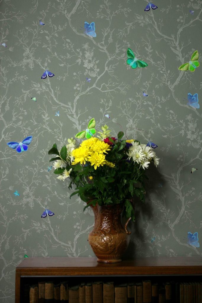 Butterflies wallpaper in Sage Butterflies wallpaper in pale Sage green with vase and flowers
