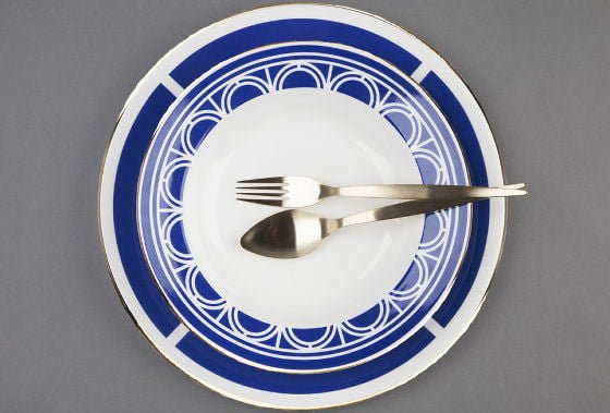Blue and white plate, soup plate and silver spoon and fork