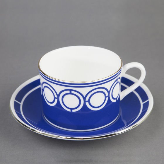 CUSTHOM cup and saucer in blue with white and gold rim