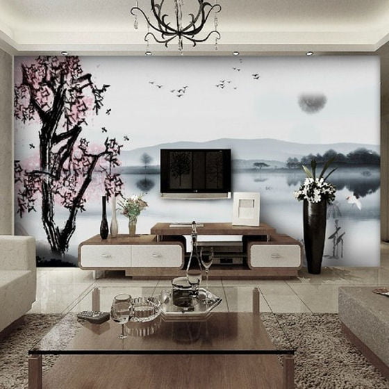 Giant wall mural of chinese landscape with white sky and lake, dark trees and pink blossoms