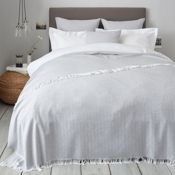 Herringbone white and grey cotton woven bedspread in contemporary bedroom