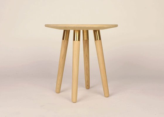 Small wooden table with brass decorative fitting at tops of legs