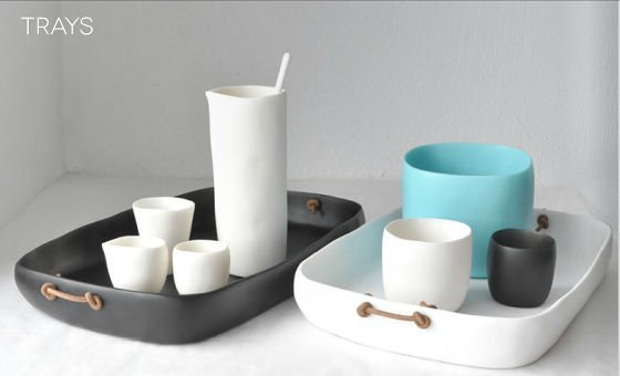 Grey and white resin trays with whie and turquoise resin cups and containers
