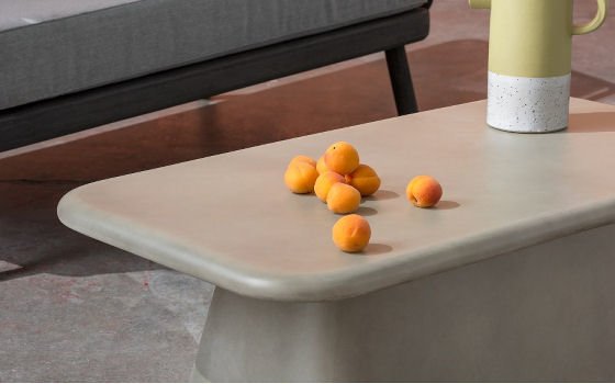 MADE Kalaw outdoor table in concrete - detail, with oranges and jug