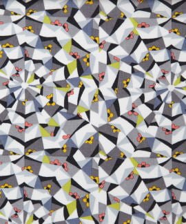 Tana Lawn design with grey, black white and yellow and red patchwork shapes