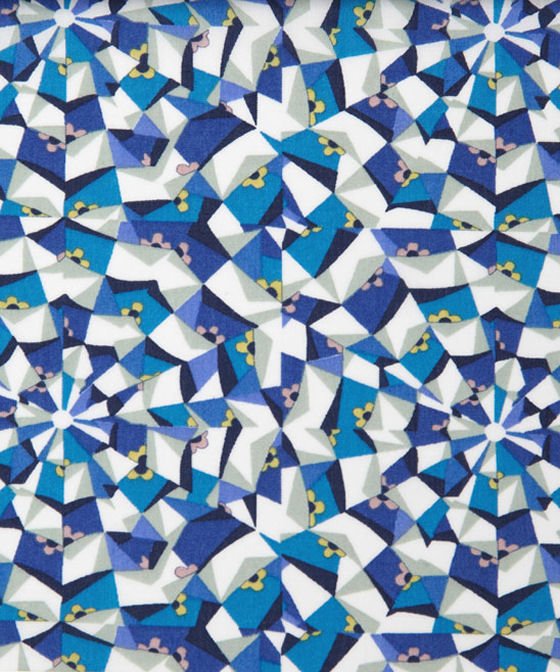 Liberty Art Fabric design with blue, white, yellow and grey geometric shapes