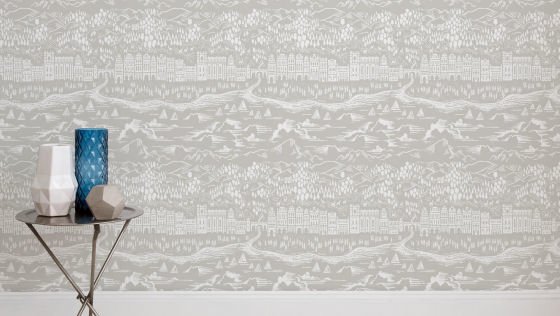 Wall of modern wallpaper by Bold & Noble in pale grey with small table and vases