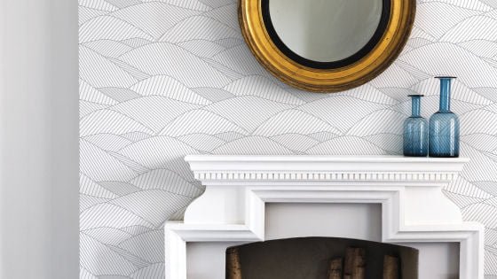 Modern wallpaper with grey hills on white on wall with fireplace and mirror