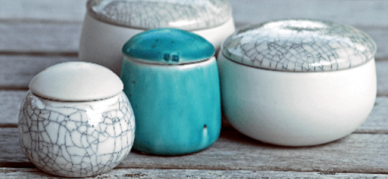 Group of lidded porcelain vessels in grey, white and turquoise