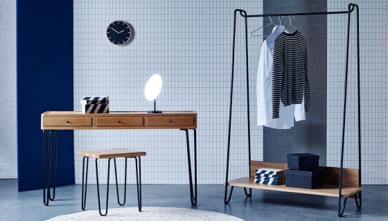 Heal's Brunel Console Table, Brunel Stool and Brunel Hanging Rail against blue geometric backdrop