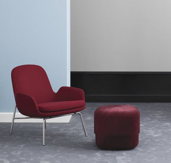 Normann Copenhagen Circus Velour Pouf in red velvet with red chair against blue wall
