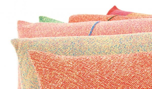 Close up of Zuzunaga colourful wool cushions