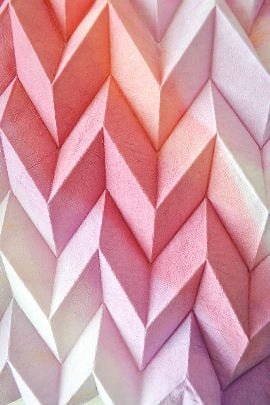 Folded textile in shades of pink