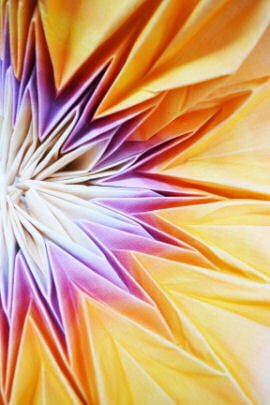Fabric folded into star shape and coloured lilac, mauve and yellow