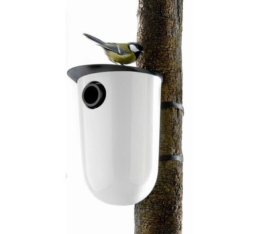 Eva Solo white ceramic nesting box on tree with bird