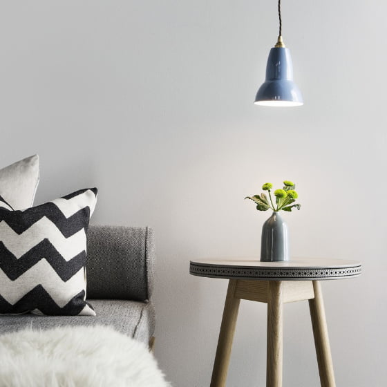 Anglepoise Original 1227 Brass Collection Pendant Lamp in blue with Brogue table and sofa and cushions