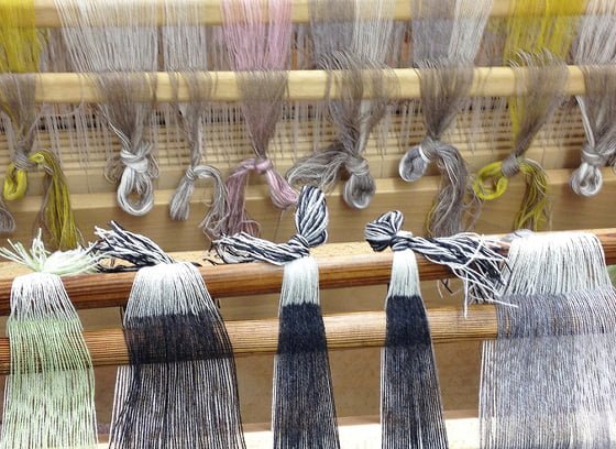 coloured yarns on a loom