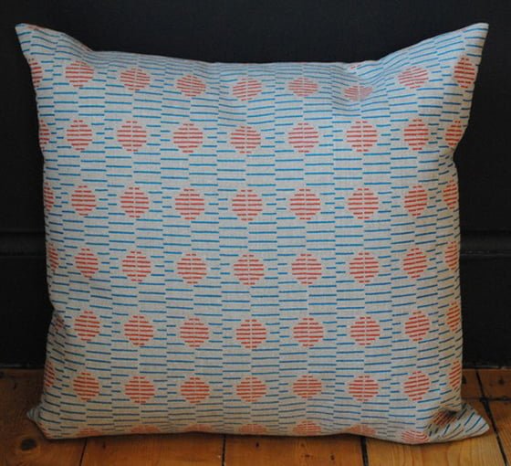 Blue and orange hand printed linen cushion by Thorody