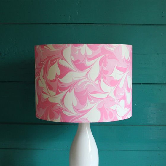 Pink and white marbled silk lampshade by Whitehorn against blue/green wall
