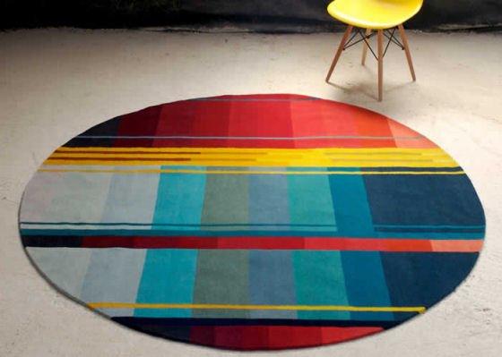Brightly coloured circular rug by Ptolemy Mann for Rugmaker