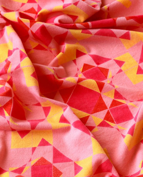 Printed wool textile in pink, red and yellow
