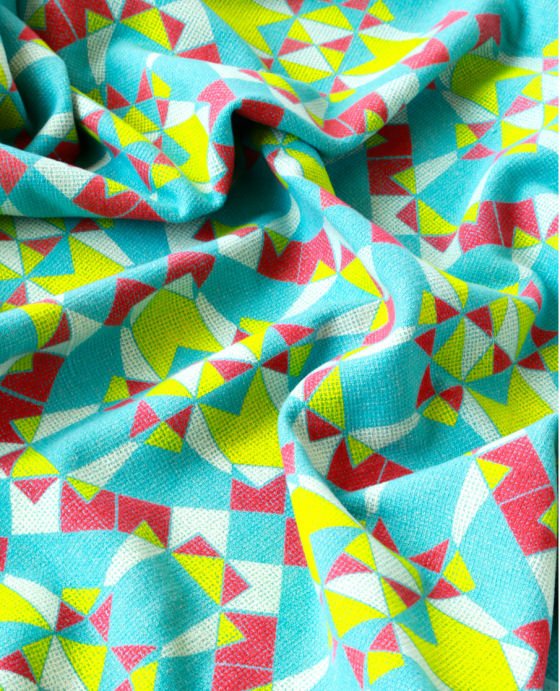 Fine turquoise wool textile printed with yellow, red and white geometric shapes 