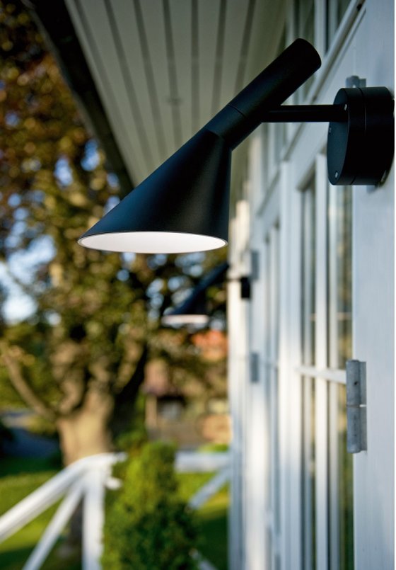 Louis Poulsen AJ50 LED Outdoor Lamp in black on contemporary building